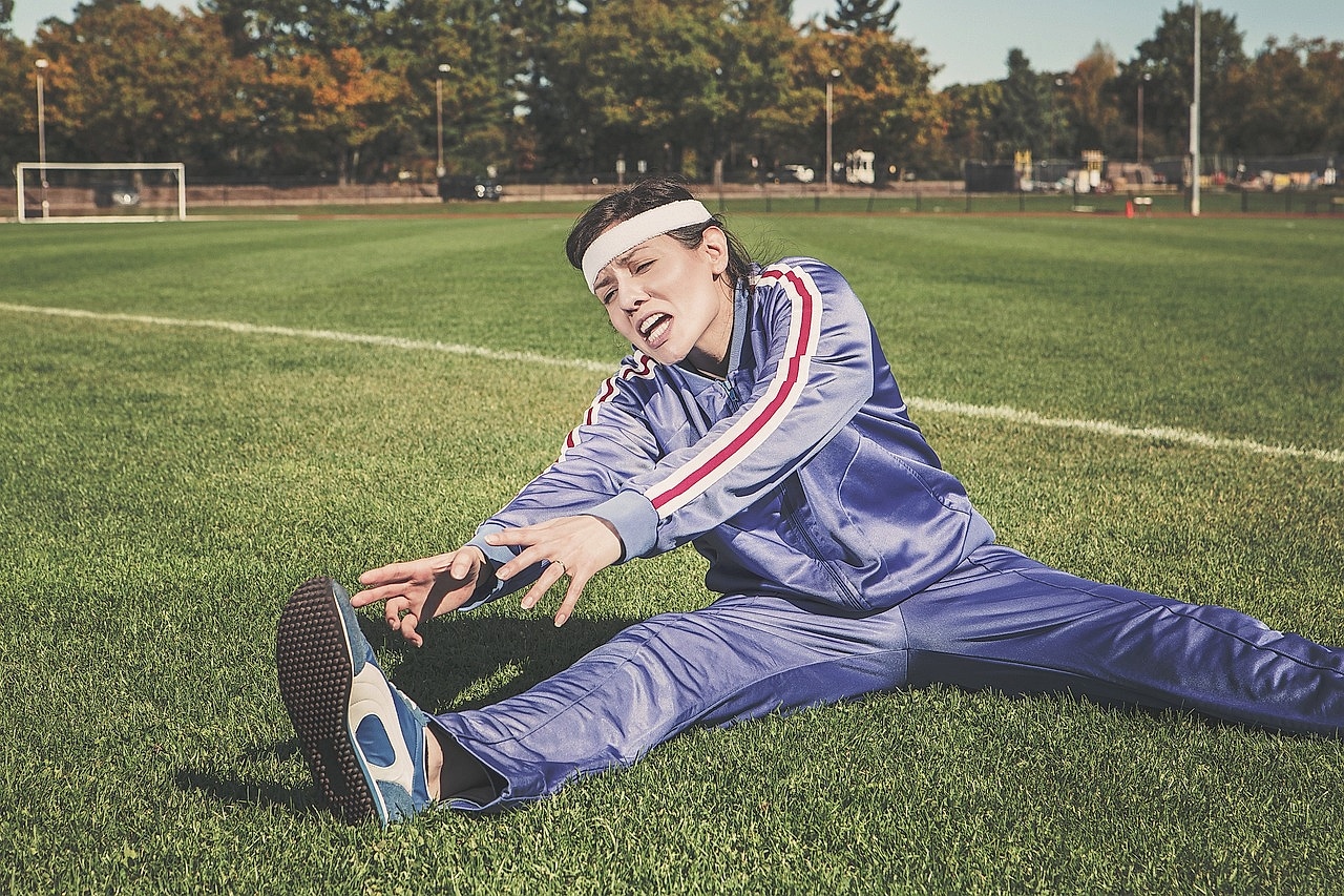 Group of seniors exercising together outdoors